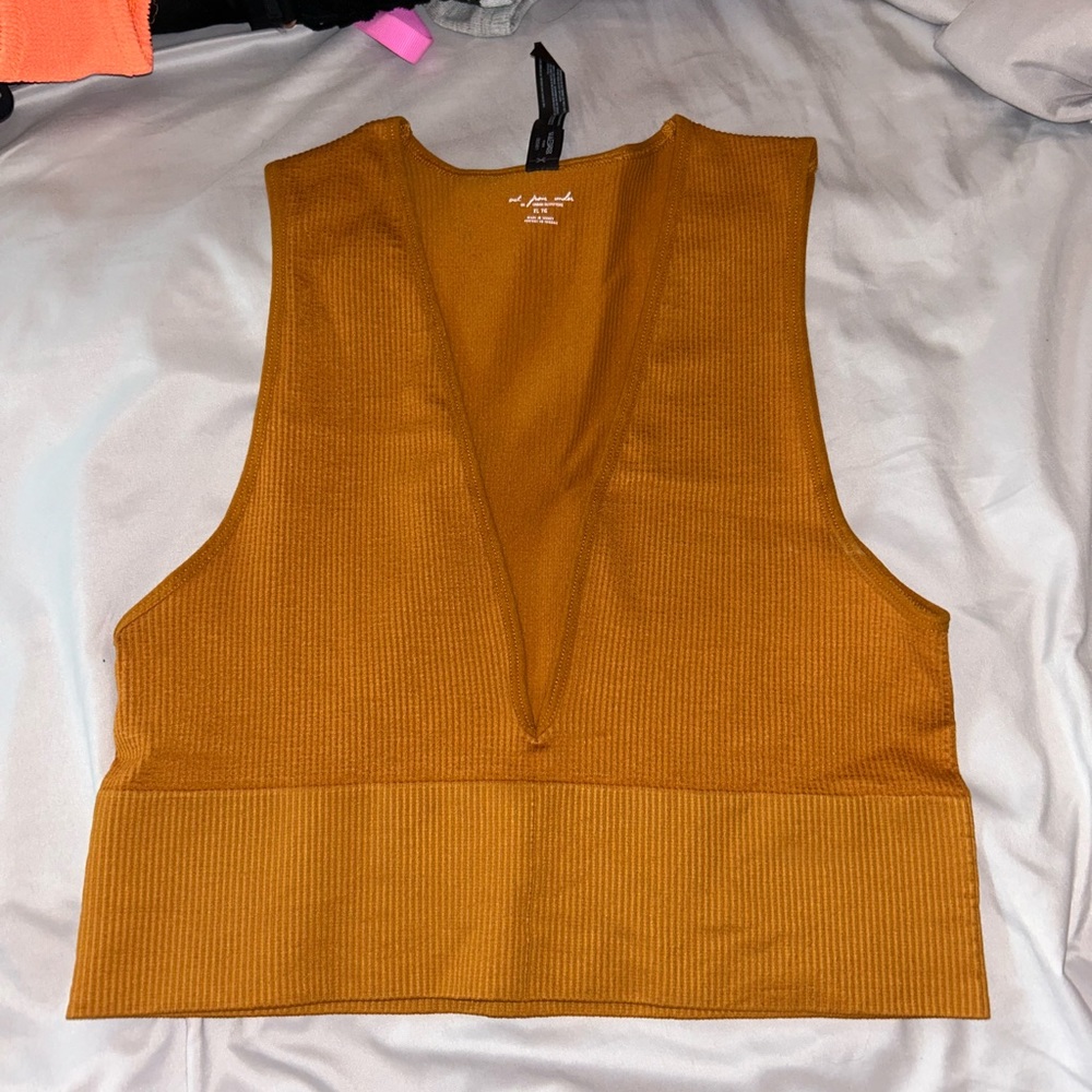 Urban Outfitters out from under tank top